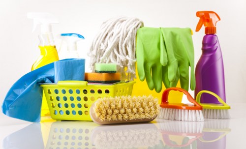 Cleaner using safe procedures with warning sign in place