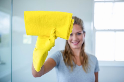 Cleaner working in a Wandsworth flat with practical access considerations